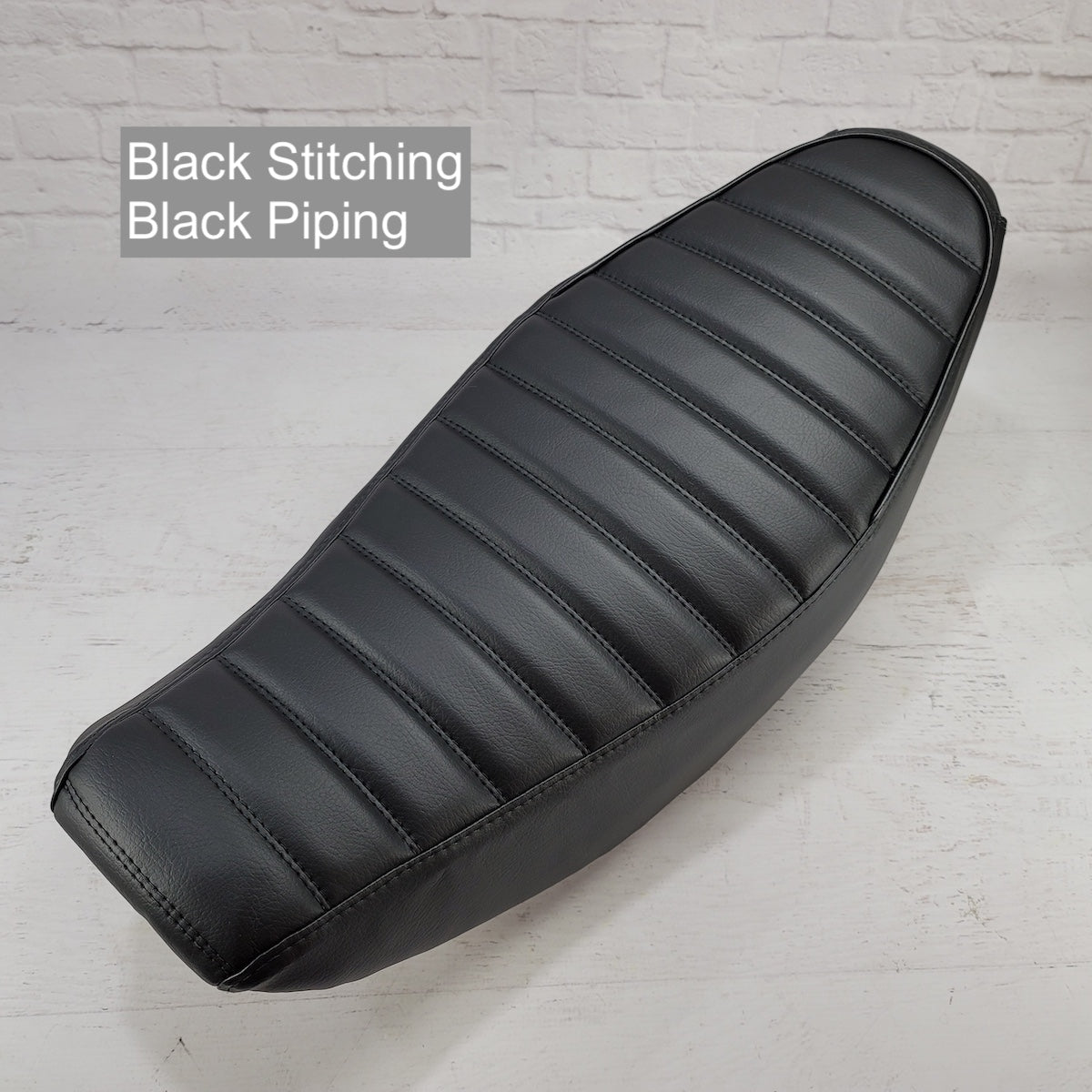 Honda Navi tuck-and-roll seat cover with black stitching and piping