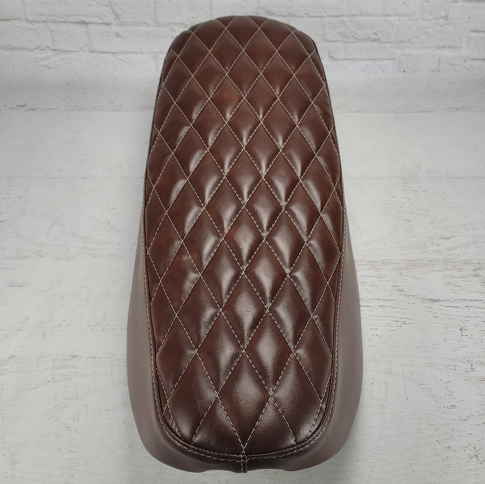 Top view of a whiskey brown diamond-stitched Honda DAX 125 seat cover with softly padded quilting, handmade by Cheeky Seats