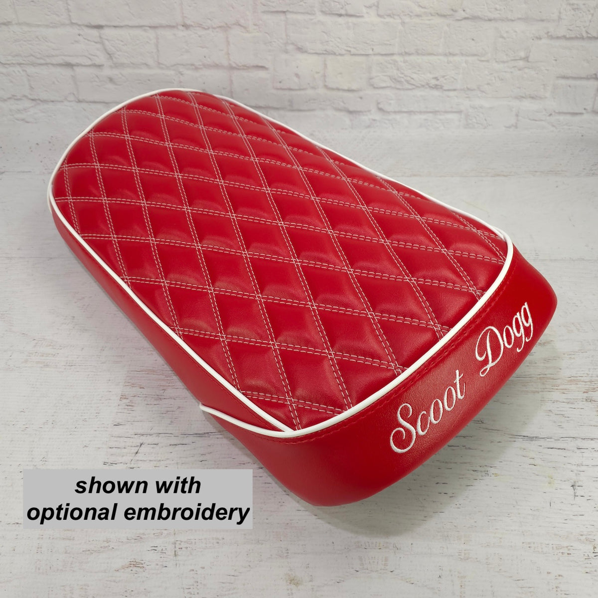 Red diamond-stitched seat cover with Scoot Dogg embroidery on the rear panel, text overlay reading optional embroidery