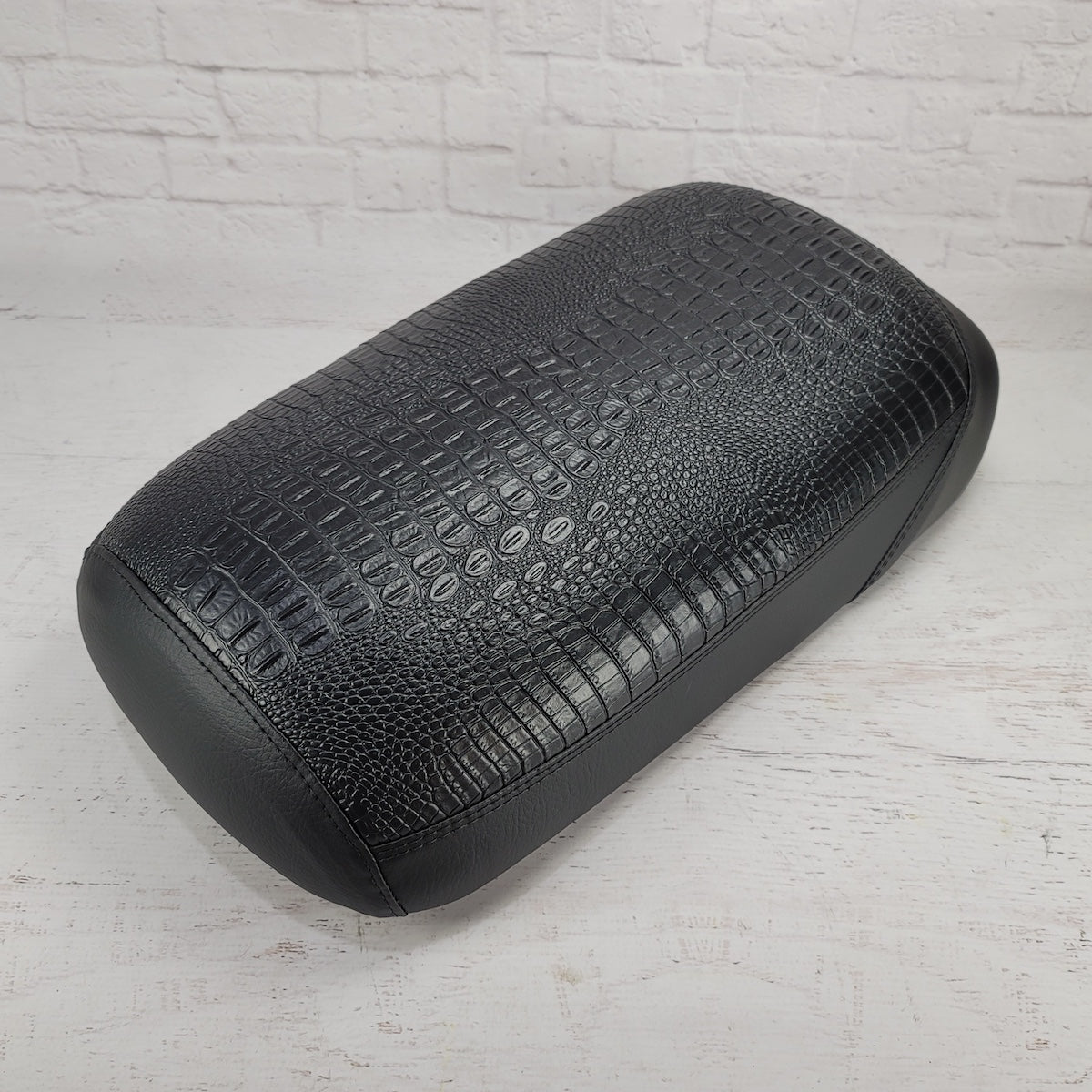 All-black faux crocodile-textured waterproof Maddog seat cover, three-quarter view, handmade by Cheeky Seats