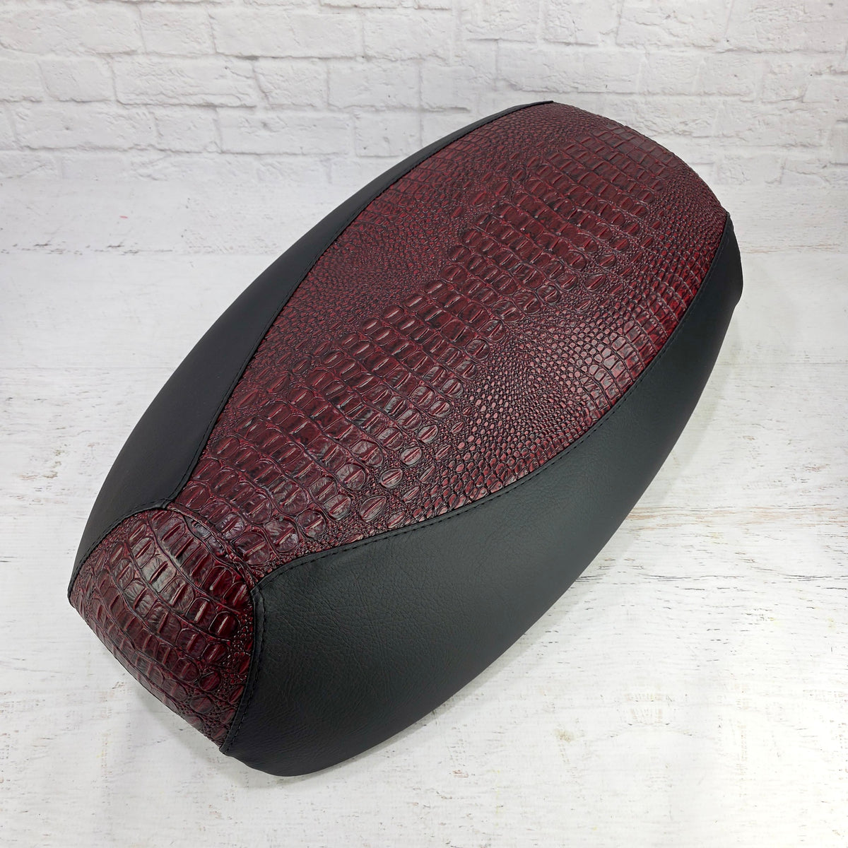 Ruby Garnet Gator Yamaha Vino 125 seat cover with a textured crocodile-style center and smooth black side panels, handmade by Cheeky Seats.