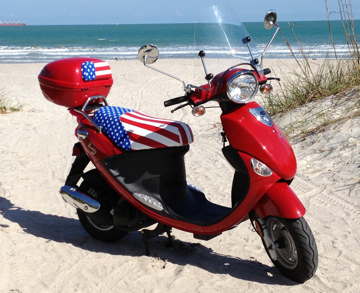 Red Genuine Buddy at the beach with an American flag Cheeky Seats cover and matching top-case pad