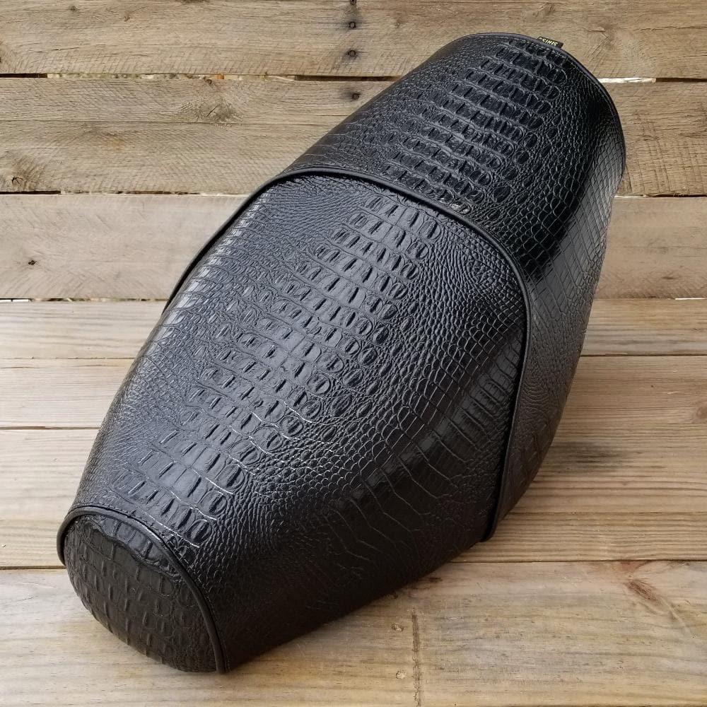 Black faux-crocodile Cheeky Seats cover for a Genuine Buddy seat, front studio view