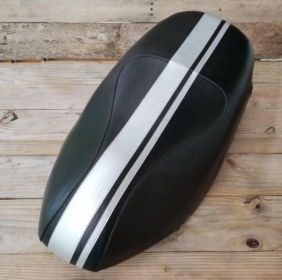 Black Piaggio Fly 50–150 seat cover with wide and narrow silver racing stripes, handmade by Cheeky Seats