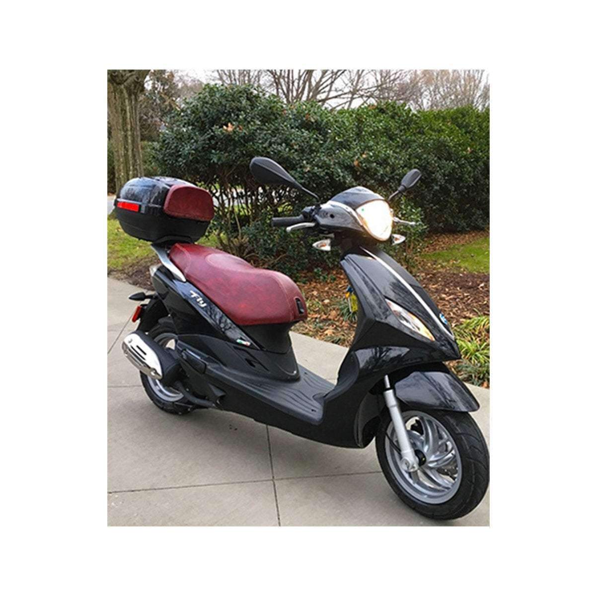 Black Piaggio Fly scooter fitted with an oxblood marbled seat cover and matching top-case pad, handmade by Cheeky Seats