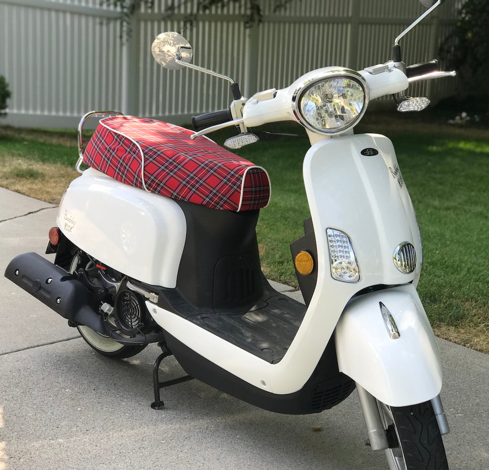 Red tartan plaid seat cover with white piping installed on a white Genuine Buddy Kick 125 scooter, handmade by Cheeky Seats