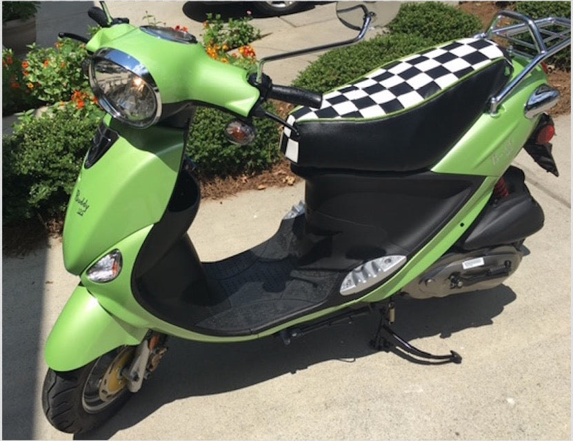 Lime-green Genuine Buddy with a black-and-white checkered Cheeky Seats standard-seat cover