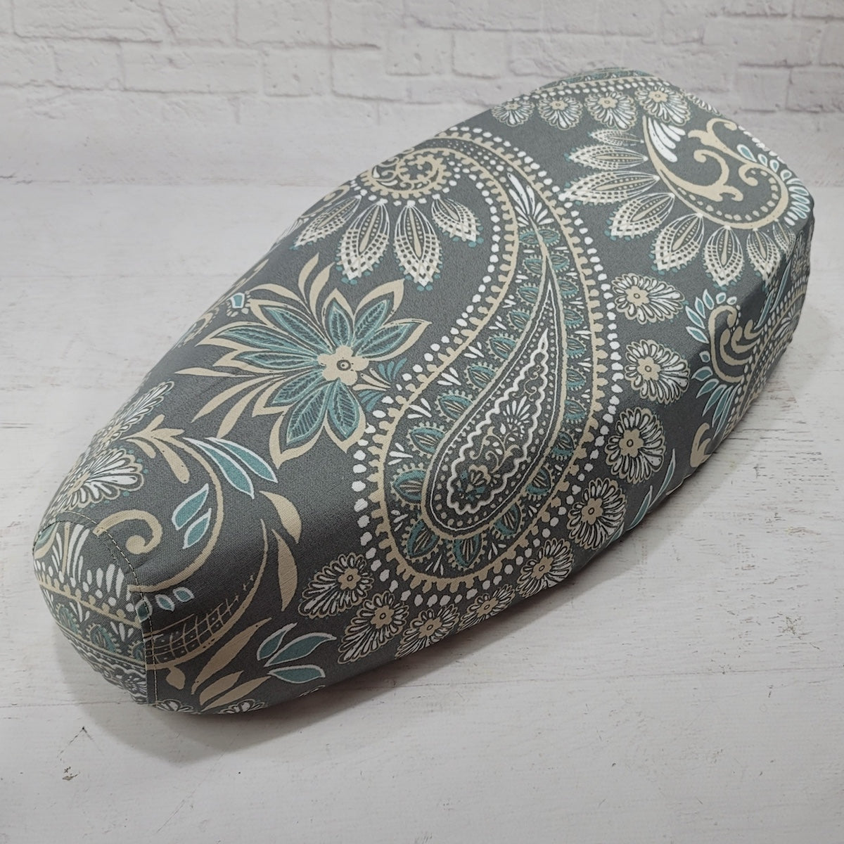Stone gray Genuine Buddy Kick 125 canvas seat cover with oversized cream and teal paisley, handmade by Cheeky Seats