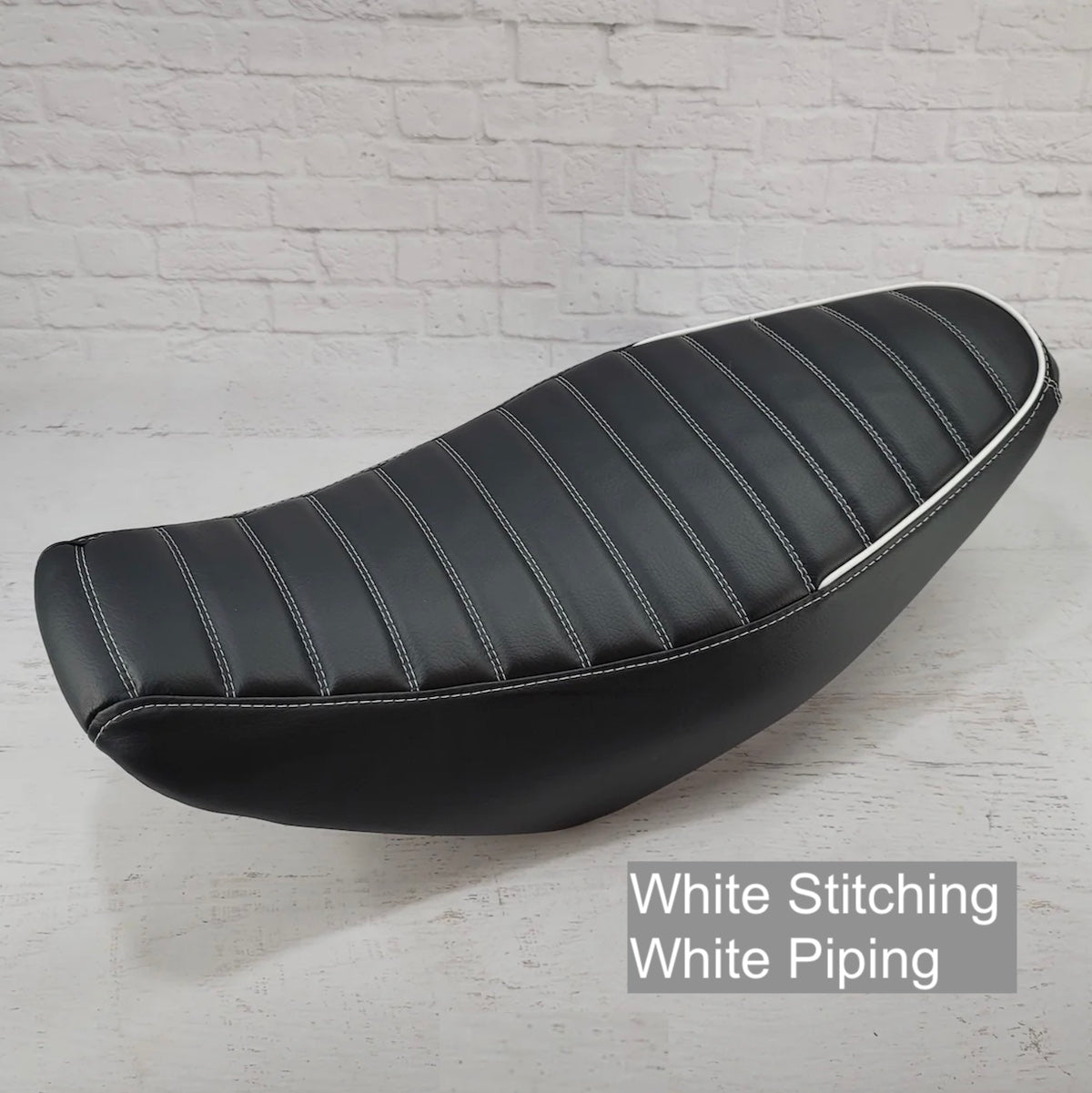 Honda Navi tuck-and-roll seat cover with white stitching and piping