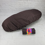 Brown honeycomb Honda DAX 125 protective seat cover with a matching pouch and vivid tropical strap, by Cheeky Seats