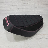 Honda Dio 1 & 2 Seat cover with Black Bride deck, Alcantara sides and matte black, trimmed with pink stitching and a pink Honda logo.  Handmade by Cheeky Seats