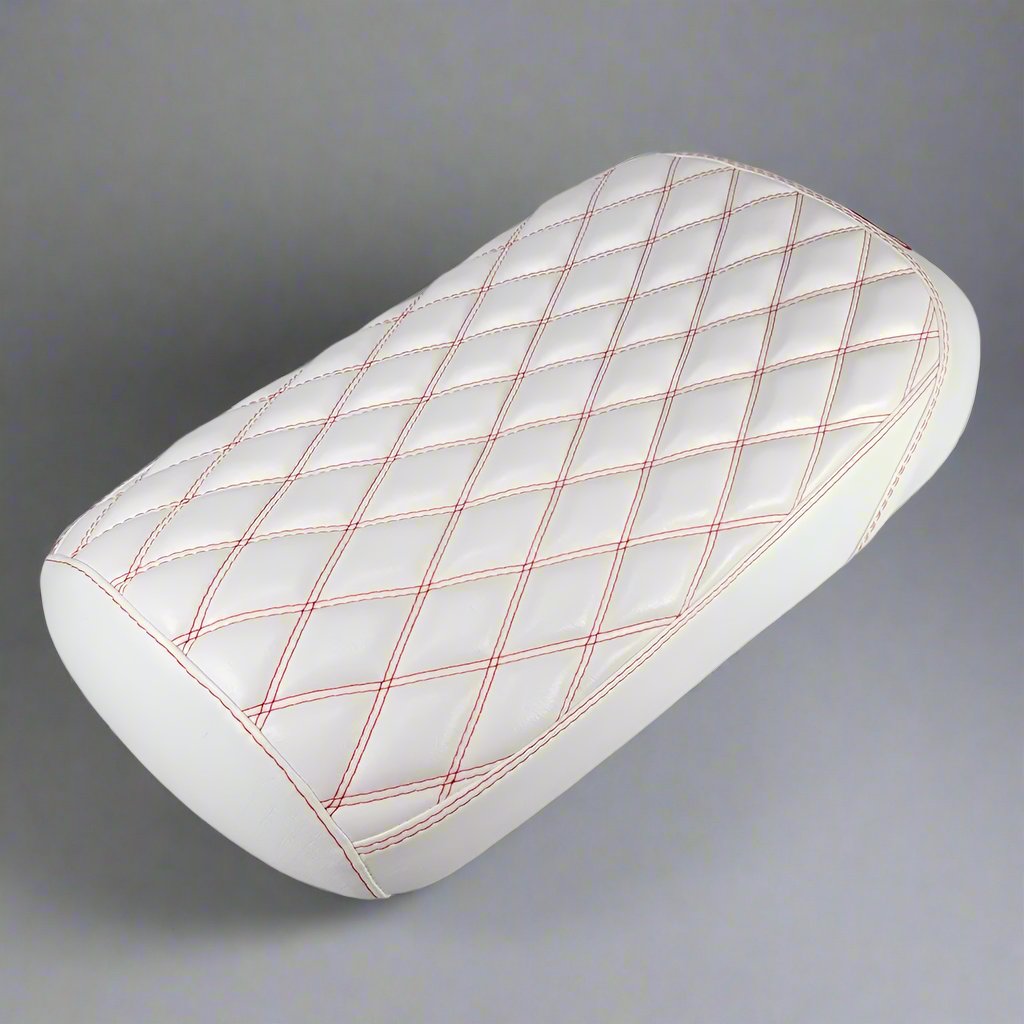 All-white diamond-stitched Maddog seat cover with red contrast stitching, handmade by Cheeky Seats