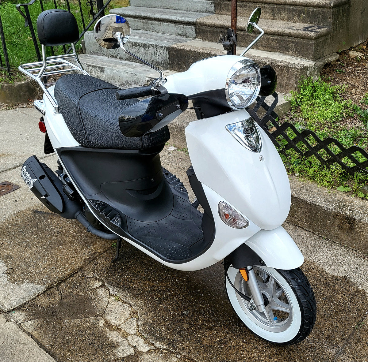 White Genuine Buddy fitted with a black faux-crocodile Cheeky Seats cover and passenger backrest