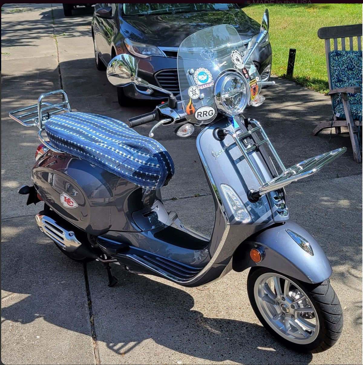 Relaxed Denim Boho seat cover fitted to a gray Vespa Sprint or Primavera, showing its tailored custom fit, handmade by Cheeky Seats.