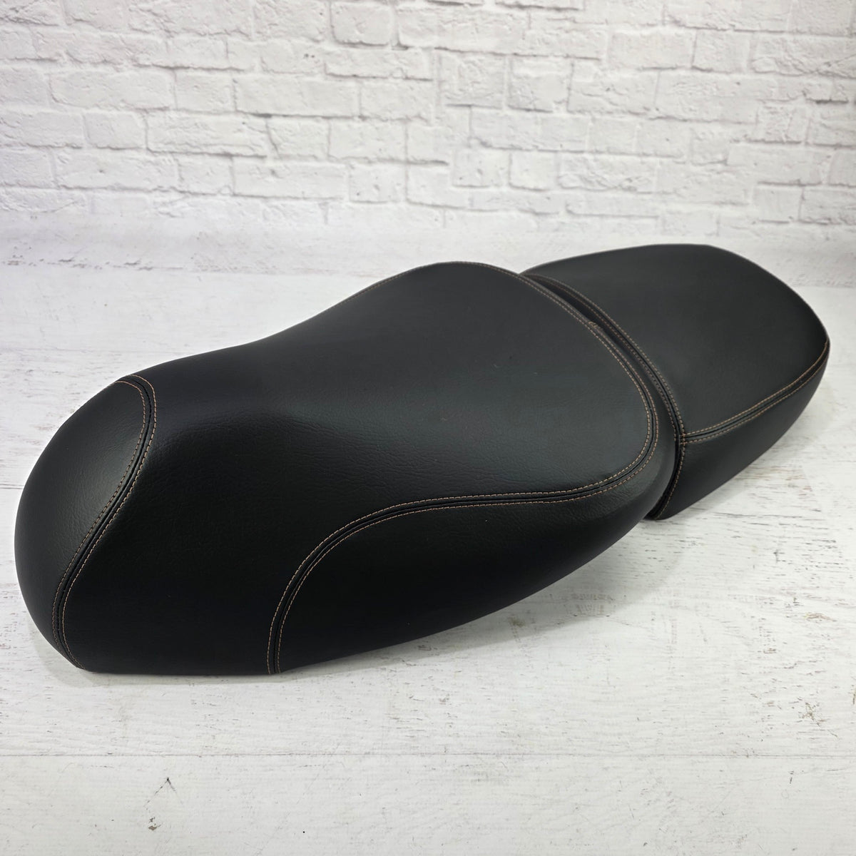 Vespa GTV minimalist black seat cover, front view