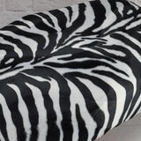 Black-and-white zebra faux-fur detail on a Cheeky Seats Genuine Buddy cover option