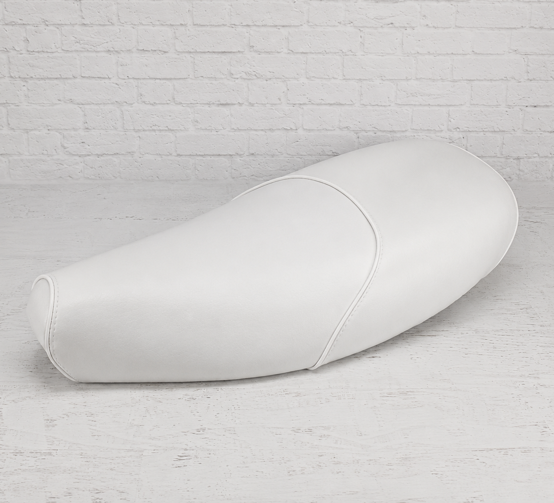 Cottage White seat cover shaped for Vespa ET and LX seats, finished with white piping and fitted seams, handmade by Cheeky Seats.