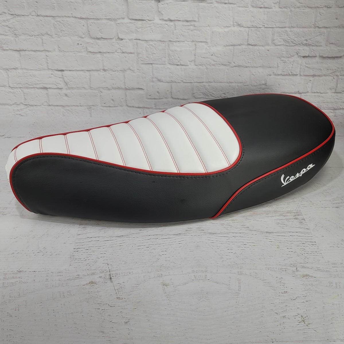 Vespa ET 2/4 two-tone padded seat cover rear view. handmade by Cheeky Seats