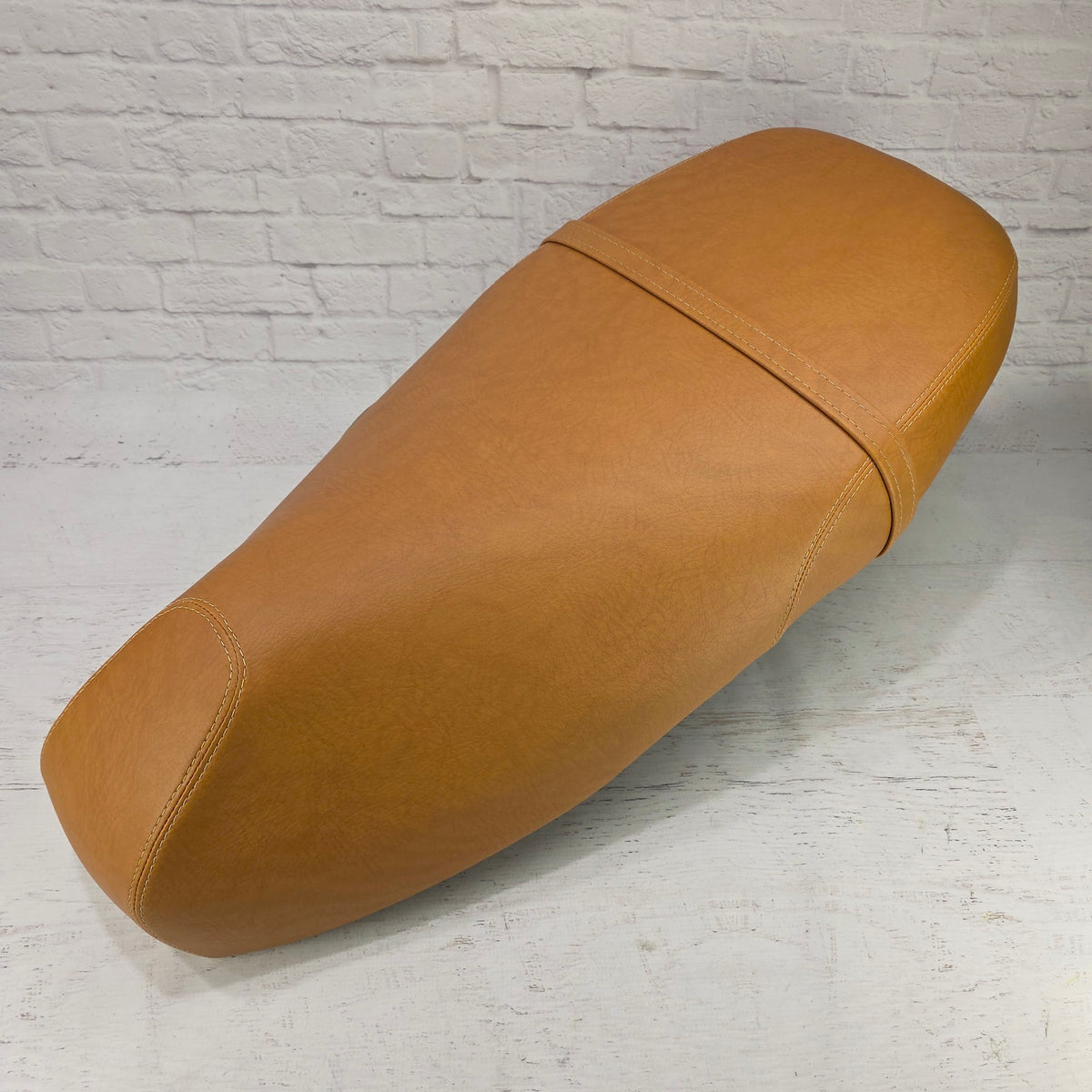 Vespa GT200 golden tan seat cover with French seams installed