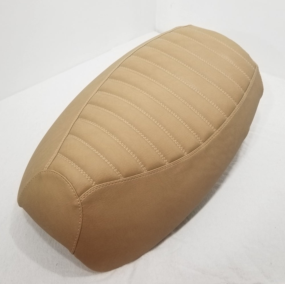 Camel Tan tuck-and-roll Yamaha Vino 125 seat cover with padded horizontal channels and matching tailored sides, handmade by Cheeky Seats.