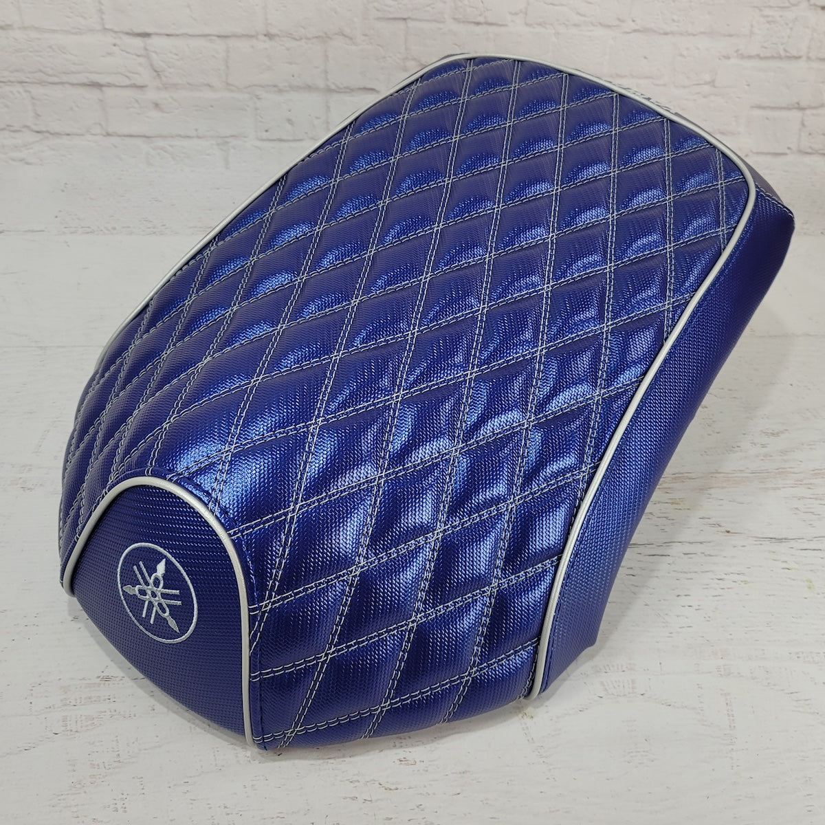 Blue Carbon diamond-stitched seat cover tailored for the Yamaha C3, XF50, Vox and Giggle, with silver piping and embroidered Yamaha emblem, handmade by Cheeky Seats.