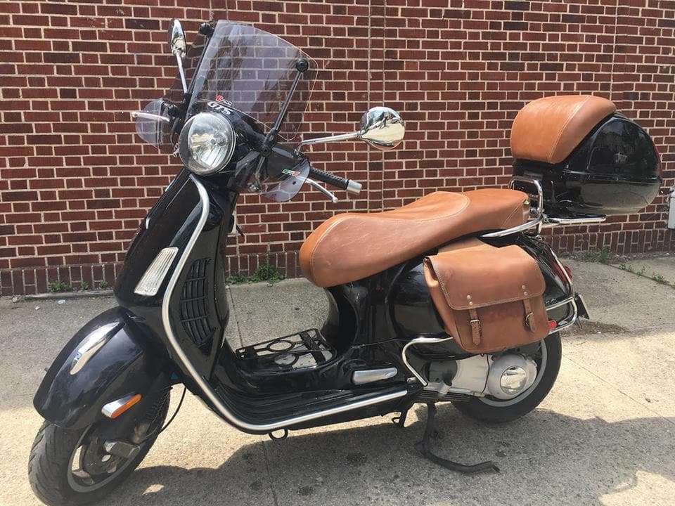 Vespa GTS distressed caramel seat cover on scooter