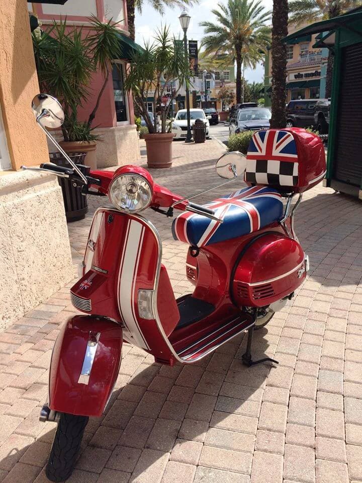 Red Genuine Stella fitted with a handmade Cheeky Seats Union Jack seat cover in red, white, and blue