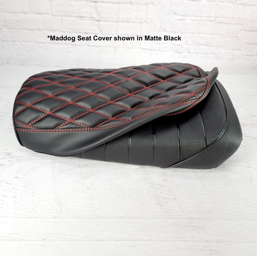 Matte black diamond-stitched seat cover with red contrast stitching, demonstrating how Cheeky Seats cover are installed