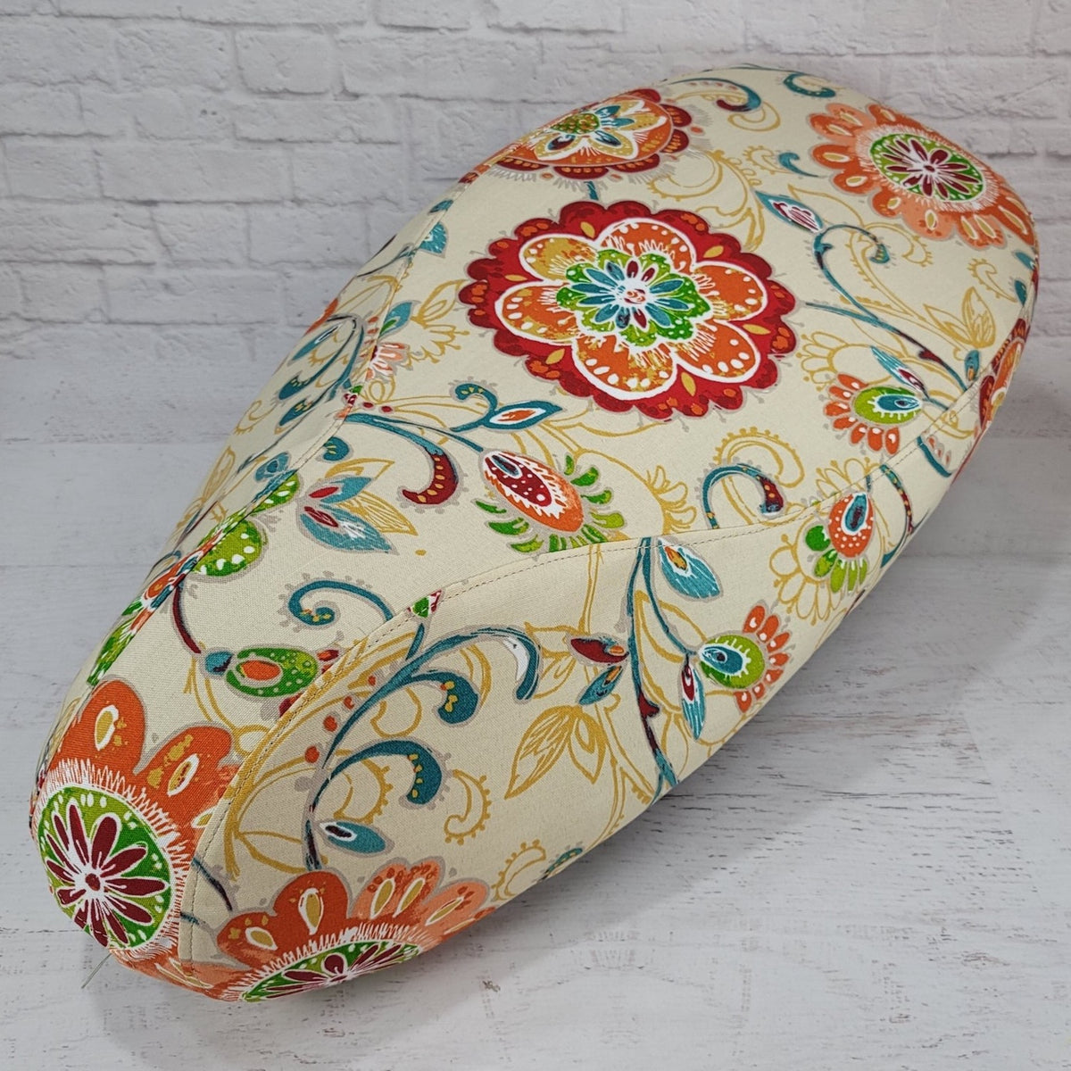 Ecru Floral breathable scooter seat cover for Vespa, Lance, Kymco and other models, with a colorful medallion print, handmade by Cheeky Seats.